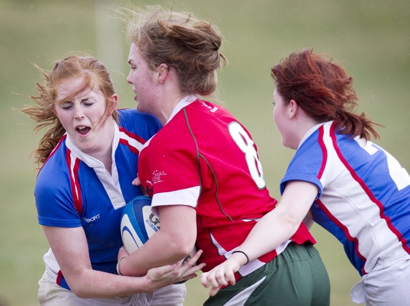 Katie Davis (left) and Meaghan McKinstry team up defensively against the Druids in Saturday&#8217;s opening game for St. Albert in the Edmonton Rugby Union spring league. St. 