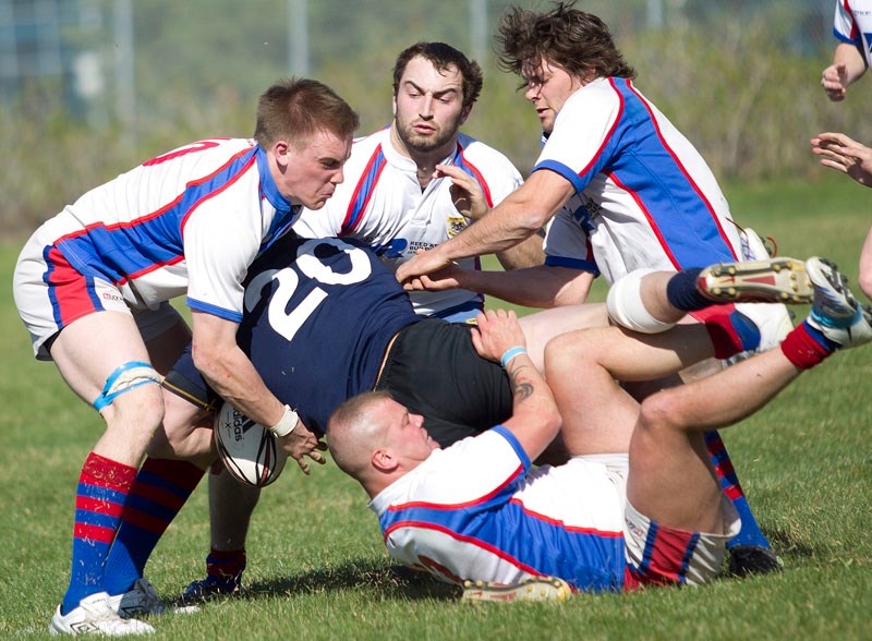 It took four St. Albert players &#8211; (L-R) Nick Gies