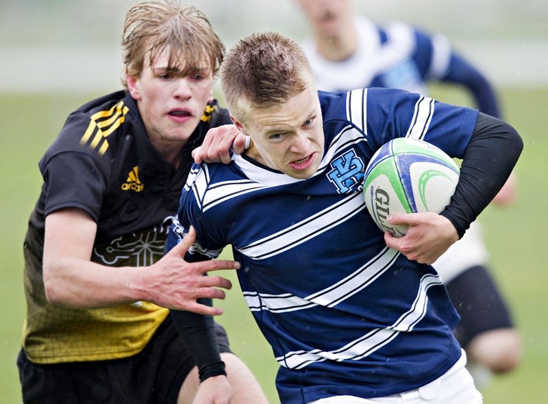 Paul Kane Blues full-back Jesse Kushneryk evades a tackle during the city semi-final playoff rugby match against the visiting Archbishop Jordan Scots from Sherwood Park at