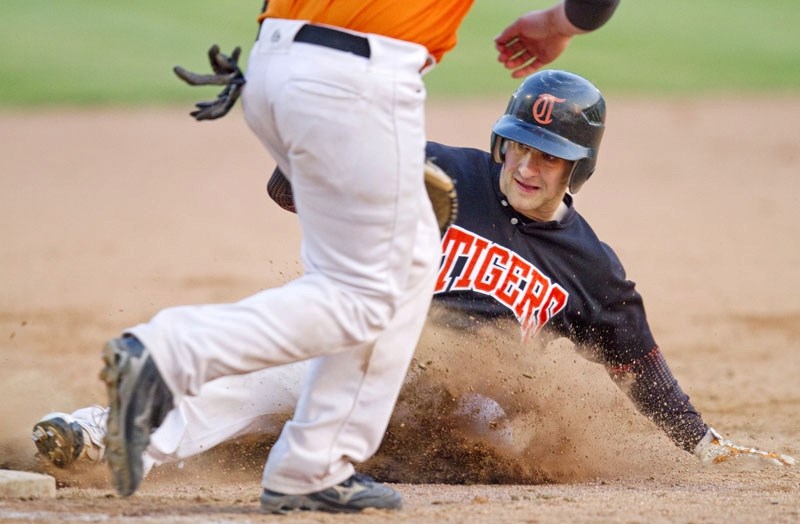 Craig Tomas of the St. Albert Tigers Black slides safely into third base in Friday&#8217;s 10-2 win over the St. Albert Tigers Orange in the Sunburst Baseball League at