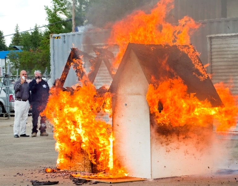 Quantum Group of Companies celebrates its new Riel Park facility with a demonstration of its fire-retardant paint.