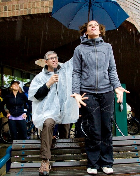 Mayor Nolan Crouse shields Collette Gasper from the Sturgeon Valley Athletic Club as she leads participants at the Roy Financial Mayor&#8217;s Walk for Charity on Saturday.