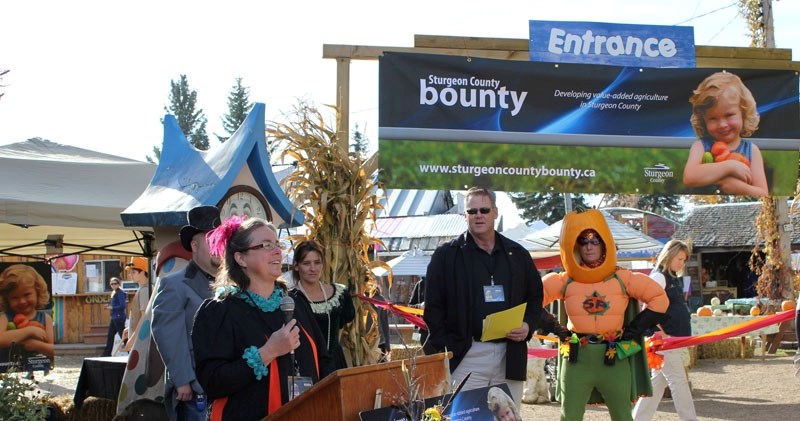Tam Andersen (far left) welcomes visitors to Prairie Gardens and Adventure Farm for last year&#8217;s edition of the Sturgeon County Bounty. This year
