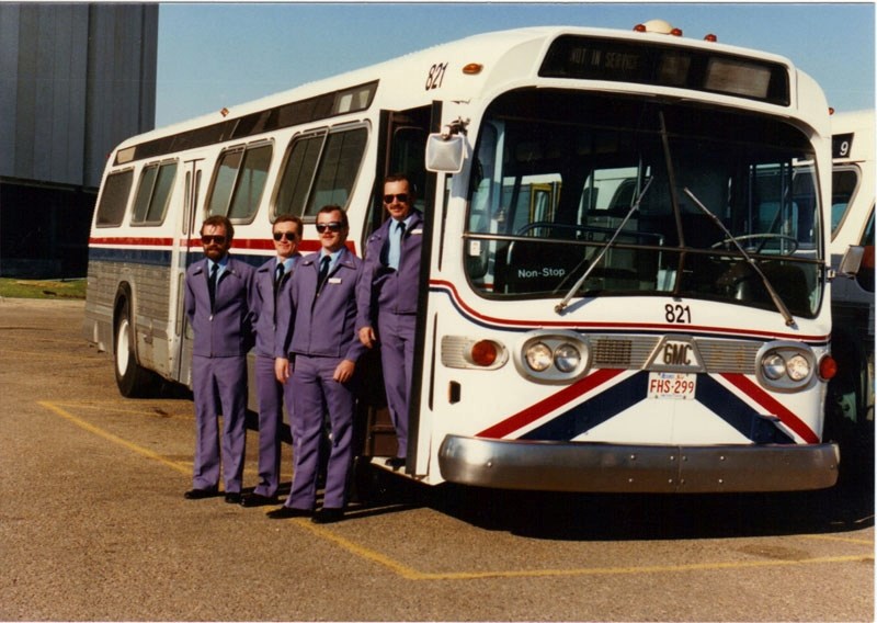 A group of St. Albert Transit operators stand beside one of the 23 GMC &#8216;New Look&#8217; transit buses the service began operations with in this file photo from 1987.