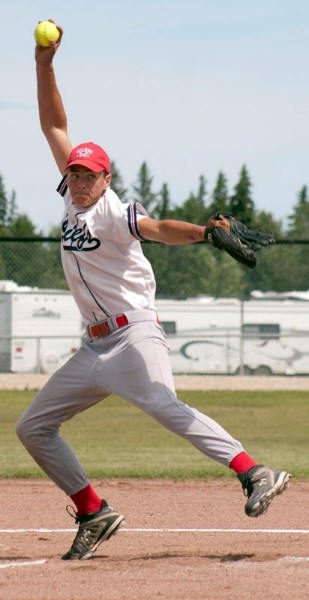 Bantam A Calahoo Chiefs pitcher Logan Petty winds and delivers during their best-of-three provincial championship series against the Irma Tigers in Calahoo on Saturday.