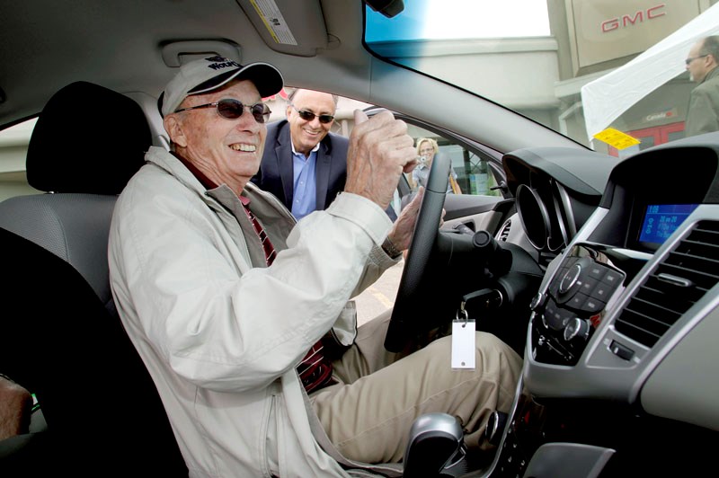 Mark Kinsella picked up the keys to his new Chevy Cruze at the Ron Hodgson car dealership yesterday. Mark won the car after sinking a hole-in-one at the Youville Home&#8217;s 