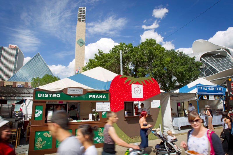 Pedestrians stroll past vendors at Taste of Edmonton in Churchill Square Thursday afternoon. This year&#8217;s festival offers up a wide variety of dishes to please any palate