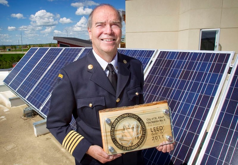 St. Albert Fire Services Chief Ray Richards stands proudly next to solar panels atop the now LEED Gold certified Fire Station No. 3 following a presentation of the