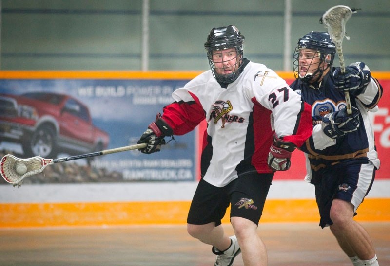 Jordan Cornfield of the St. Albert Miners carries the ball while pressured from behind in Tuesday&#8217;s playoff match against the Edmonton Outlaws at Bill Hunter Arena. In