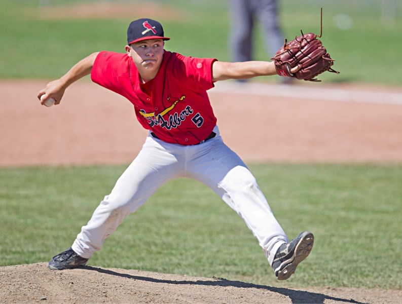 Kory Keohane of the St. Albert Cardinals winds up for a pitch against SEEBA 2 at the Baseball Alberta midget performance championship Saturday at Centennial Park in Sherwood