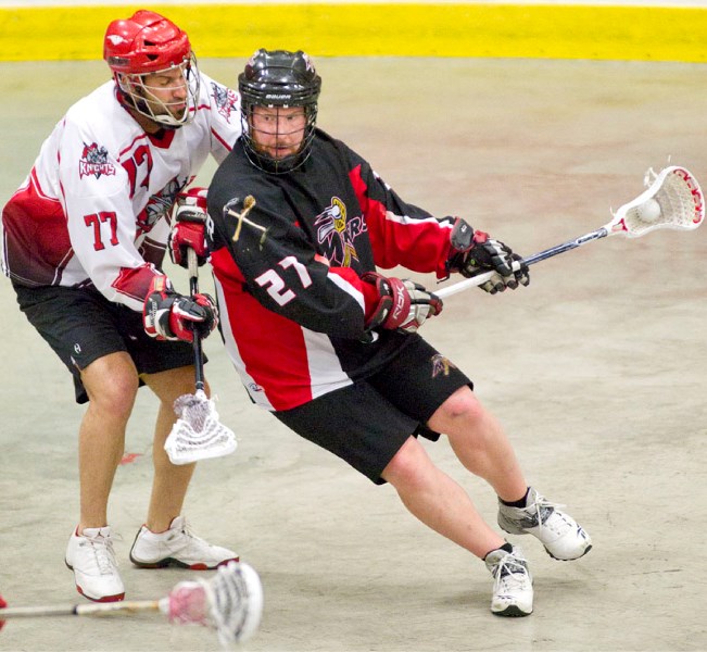 Jordan Cornfield of the St. Albert Miners busts a move against Jeff Roth of the Calgary Knights in game two in the best-of-five senior B provincial final Sunday at