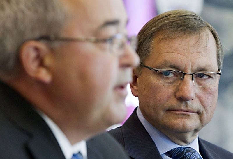 Alberta Premier Ed Stelmach listens to Solicitor and Public Security