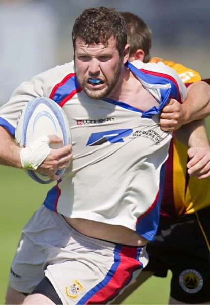 Dave Brennan of St. Albert has his jersey torn while shredding a tackle in Saturday&#8217;s 39-32 come-from-behind victory over the Norwesters in second division rugby. Down