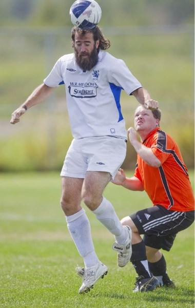 Scott Bohachyk heads the ball for Chester City in front of Shane Moore of Arsenal in Sunday&#8217;s match at Riel Park. Bohachyk scored once in the 4-1 win as Chester