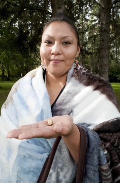 Sarah Bird of Edmonton holds the symbolic &amp;quot;bear&amp;quot; marble she received upon completion of a 42-day treatment program at the Meadowview Women&#8217;s Health