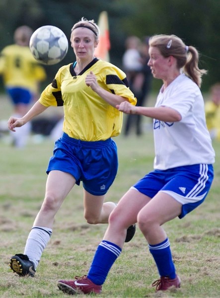 Amy Suggitt (left) of the Morinville Ladies and Jacquie Zabiran of Mavericks 09 eye up the ball in Wednesday&#8217;s first-place showdown in the St. Albert Women&#8217;s