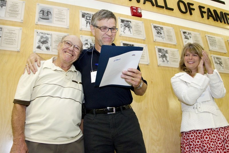 Mayor Nolan Crouse gives long-time St. Albert resident and prominent community figure Larry Mitchell a hug after it was declared that Sept. 6