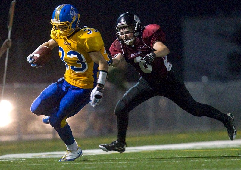 Hayden Borlase of the Bellerose Bulldogs hunts down a runaway Bev Facey Falcon in the Carr conference season opener Thursday in the metro Edmonton league. Facey