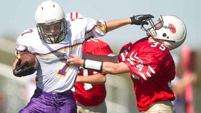Blake Schafer of the St. Albert 49ers tries to slow down Seth Waselenchuk of the St. Albert Fury in Saturday&#8217;s bantam game at the Riel Park turf field. Waselenchuk