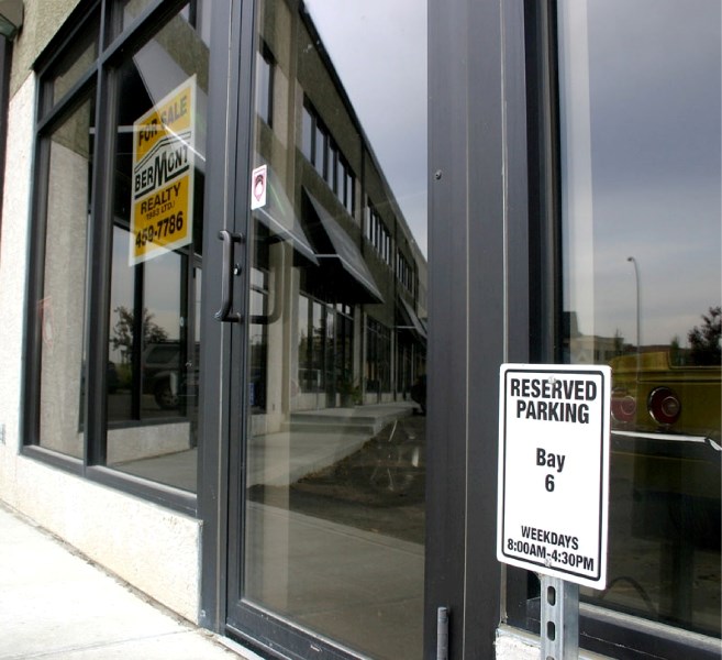 Owners of business condominium units at 20 Circle Dr. say the city&#8217;s system of tying development permits to parking space requirements makes their spaces unmarketable