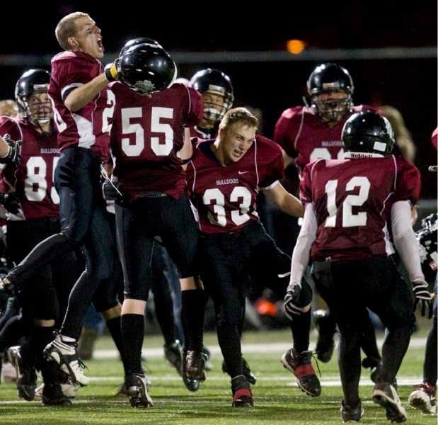 The Bellerose Bulldogs celebrate their 13-10 triumph against the rival St. Albert High Skyhawks in the ninth edition of the Battle of St. Albert on Thursday night at the Riel 