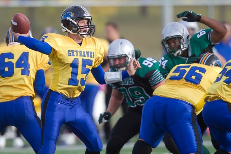 Quarterback Keith Zyla of the St. Albert High Skyhawks winds up to throw the ball against the Austin O&#8217;Brien Crusaders in Thursday&#8217;s metro Edmonton Carr