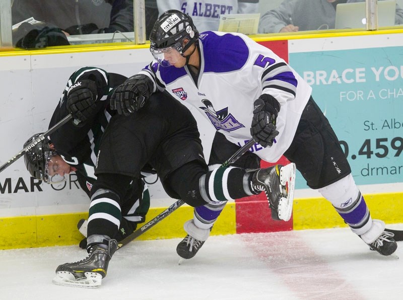 St. Albert Steel defenceman Kyle Scaber sends a Sherwood Park Crusader into the boards in Friday&#8217;s 3-2 overtime loss at Performance Arena. The next night in Sherwood