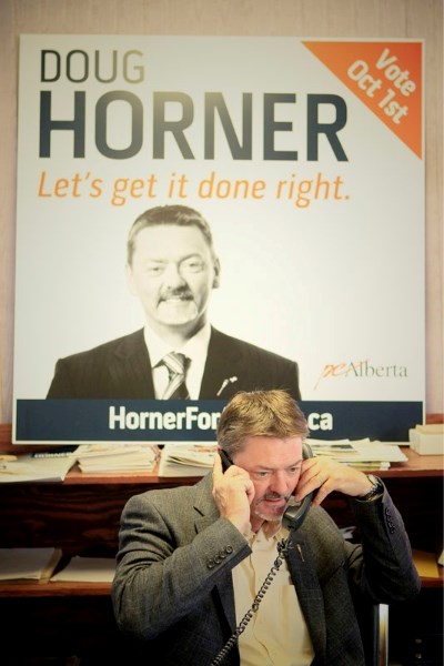 PC Alberta leadership hopeful Doug Horner works the phones at his campaign office in west Edmonton on Saturday
