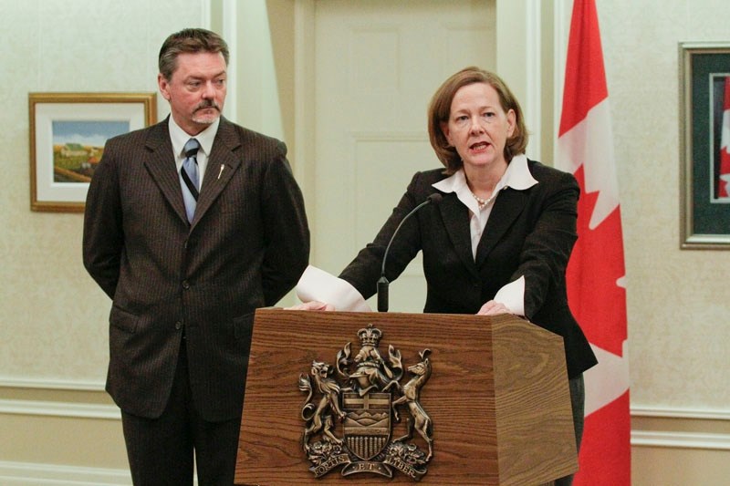 Premier-designate Alison Redford responds to a media question after announcing that Doug Horner will be her deputy premier during a press conference at Government House in
