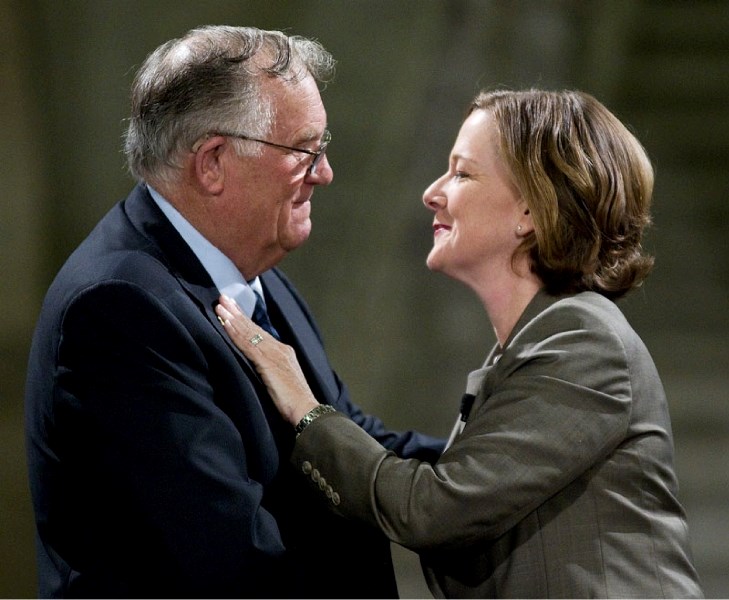 Lt.-Gov. Donald Ethell congratulates Premier Alison Redford during a swearing-in ceremony at the Alberta legislature Friday morning. Redford is now officially Alberta&#8217;s 