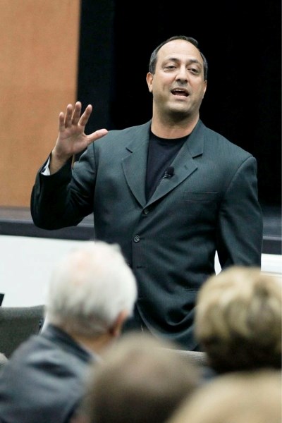 Ian Hill speaks to a crowd of listeners at the Morinville Community Centre on Thursday
