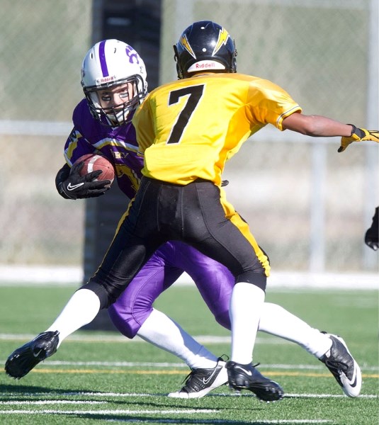 Seth Waselenchuk of the St. Albert Fury busts a move against the Edmonton Chargers in Saturday&#8217;s bantam football game at the Riel Park turf field. With first place on