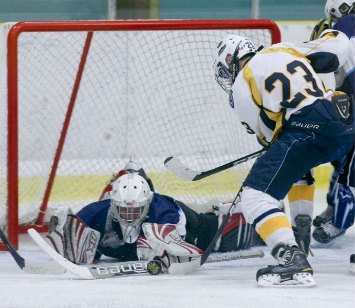 Thomas Friesen of the St. Albert Sabres is denied a goal by Maple Leafs&#8217; netminder Eden Sharp in last weekend&#8217;s bantam AAA game at Akinsdale Arena. Ethan Lazaro