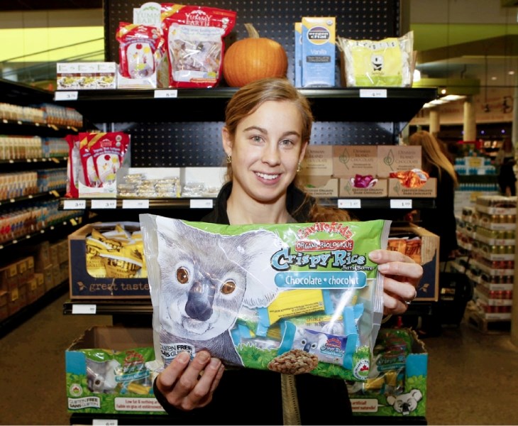 Nadine Nellissen shows off some of the healthy Halloween candy displayed at Amaranth Whole Foods Market in the Enjoy Centre.