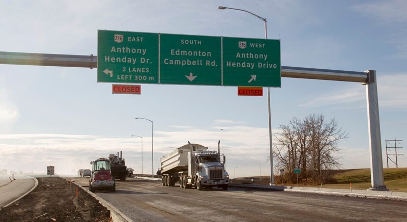 New signs above Campbell Road await the opening of the northwest leg of Anthony Henday Drive