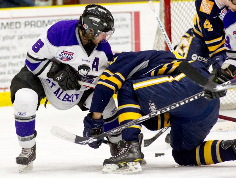 Assistant captain John Baird of the St. Albert Steel battles for the puck in front of the Grande Prairie Storm net in Saturday&#8217;s 4-2 loss at Performance Arena. The