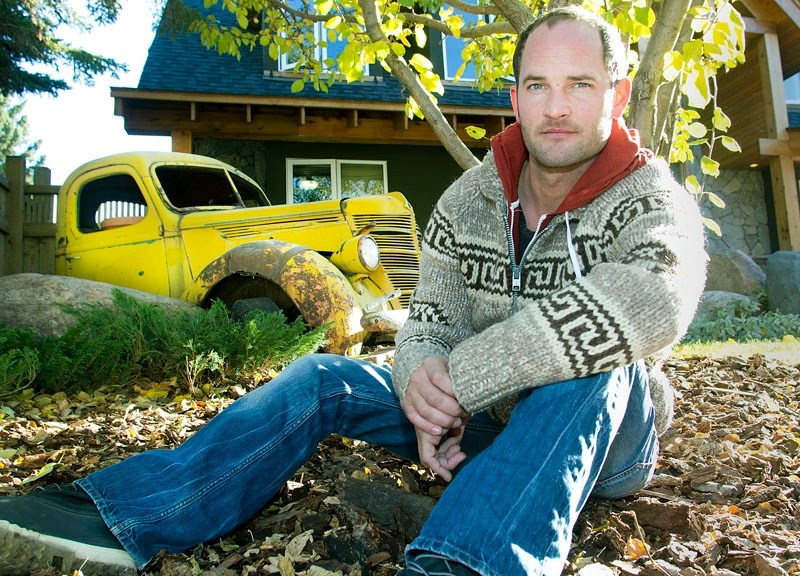 St. Albert resident and artist Myles MacDonald took a 1939 International pickup truck and buried half of it in his front yard as part of his aesthetic vision for his