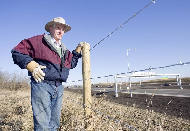 St. Albert resident Derrick Harris looks out over the stretch of Anthony Henday Drive that passes behind his Akinsdale neighbourhood. Harris observed a large amount of dust