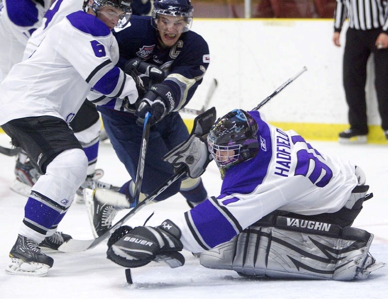 St. Albert Steel netminder Rhys Hadfield reaches out for a loose puck