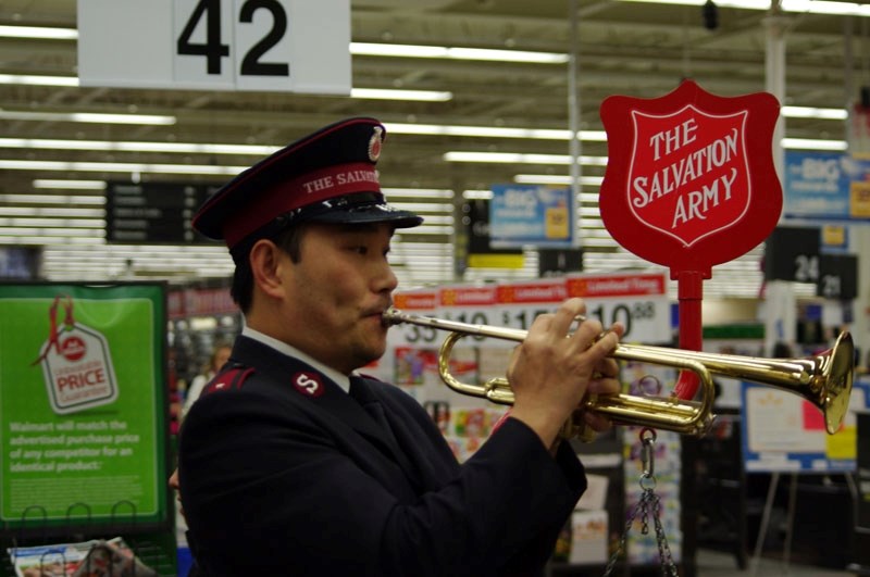 Lieut. Peter Kim of the St. Albert Salvation Army belts out a tune at the St. Albert Walmart as part of the 2011 Christmas Kettle Campaign.