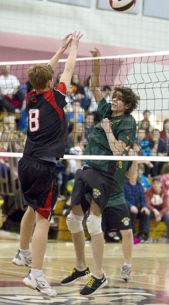 Noah Cunningham (left) of the Sir George Simpson Voyageurs and Graeme Scheffer of the William D. Cuts Crusaders went toe-to-toe at the net for the ball in the SAPEC city