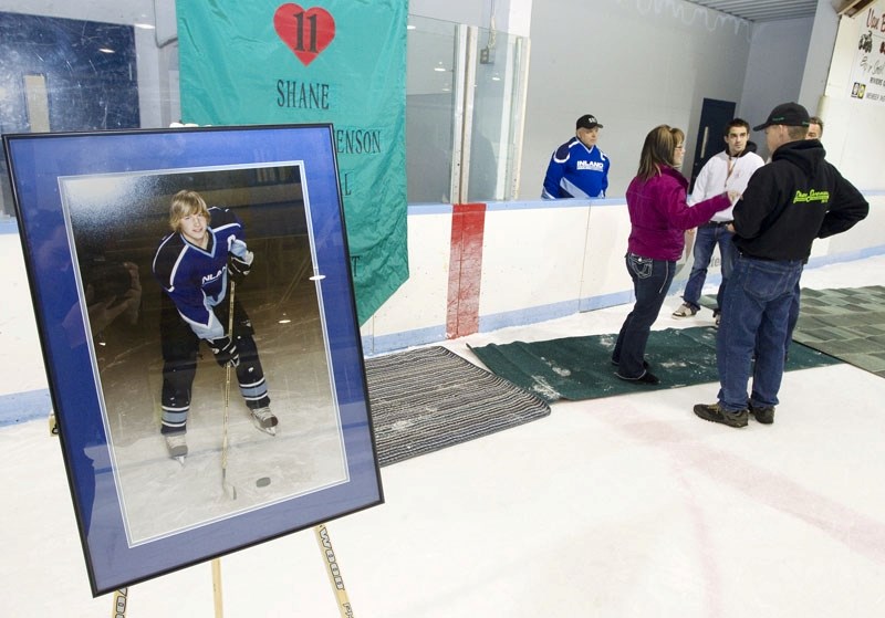 A portrait of Shane Swenson stands in the Riviere Qui Barre Arena on Sunday