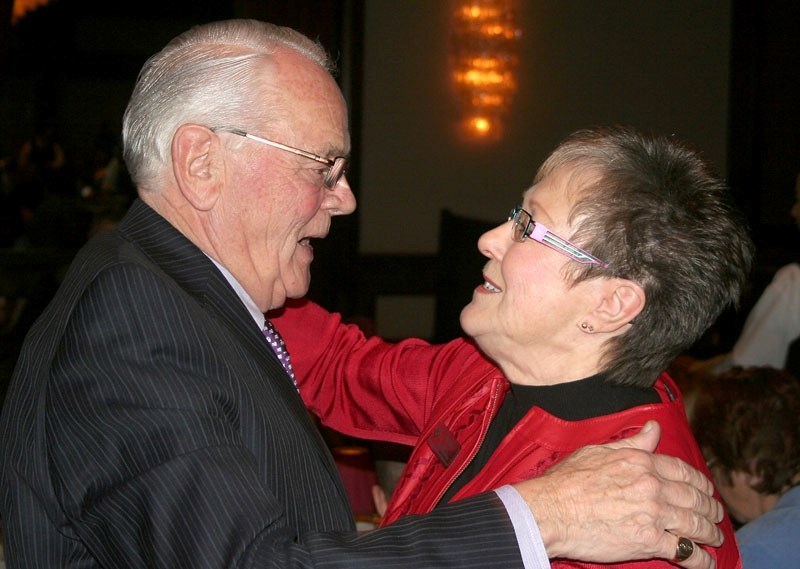 Gareth Jones is congratulated by his nominator Pat Phelan after receiving his trophy at the Stars of Alberta Volunteer Awards in Edmonton on Monday.