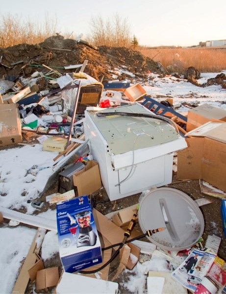 This was the scene at an illegal dump site near Poundmaker and Veness roads before city crews cleaned it up on Thursday night.