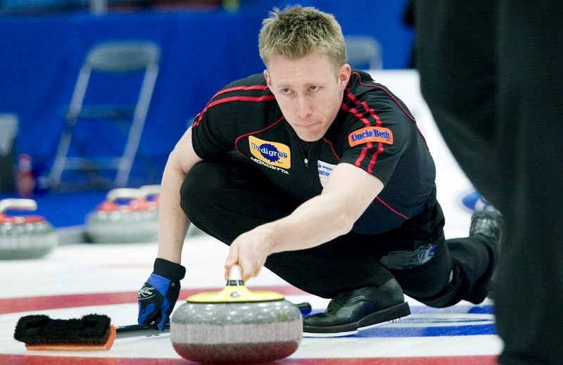 Olympic gold medallist Marc Kennedy aims for the broom at the 2011 Continental Cup at Performance Arena. The St. Albert Curling Club product qualified for his third Olympic