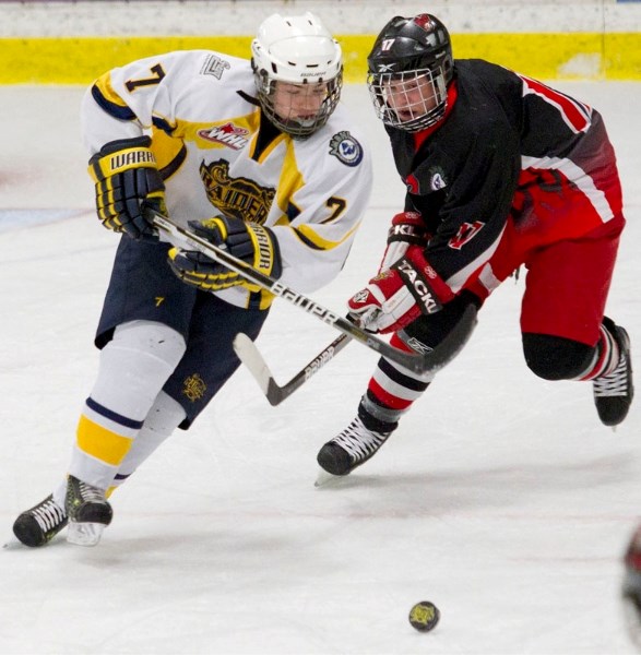 St. Albert Sabres&#8217; defenceman Christopher Verklan pulls away from Shawn Weber of the Lloydminster Heat in Sunday&#8217;s bantam AAA game at Akinsdale Arena. The Sabres