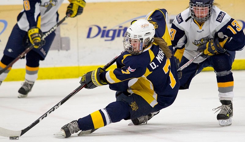 Deanna Morin of the St. Albert Slash controls the puck while tripped up during an Alberta Major Midget Female Hockey League game in St. Albert. Her 22 points in 16 games