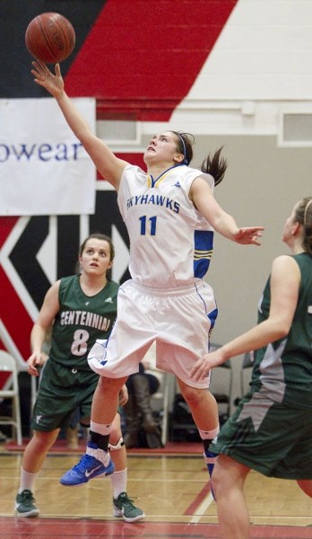 Paige Knull of the St. Albert Skyhawks stretches for the ball against the Centennial Coyotes of Calgary during Saturday&#8217;s third-place game at the 30th annual REB