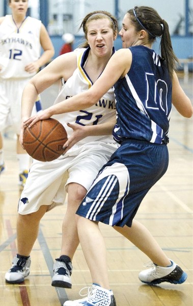 Haley England of the St. Albert Skyhawks busts a power move against Tiana Woyewitka of the Paul Kane Blues in Wednesday&#8217;s Metro Edmonton Premier Conference match at the 