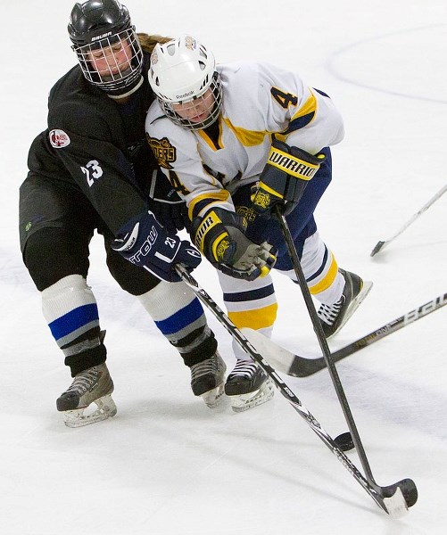 CHECKMATE &#8211; Cassandra Russell of the Edmonton Thunder keeps close tabs on Delaney Martin of the St. Albert Slash at Castledowns Arena on Dec. 22 in the last game for